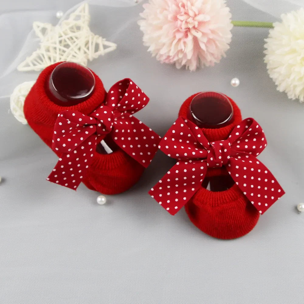 Soft grey cotton anti-slip baby girl socks with a contrasting white bow