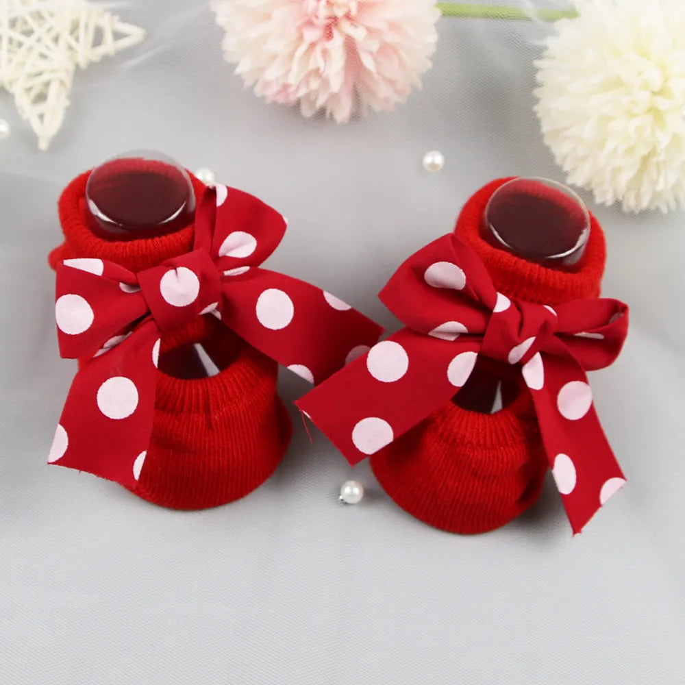 Close-up of the stretchy cotton material of anti-slip baby girl bow socks