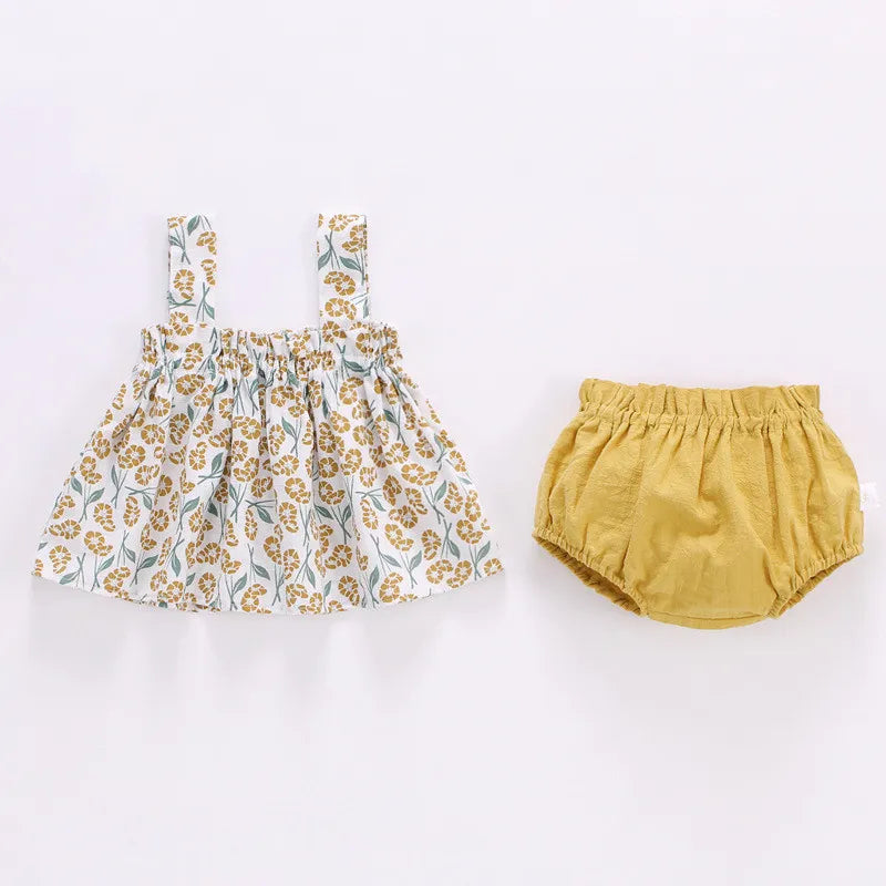 Full shot of adorable baby girl's summer mini dress set in pink, perfect for infant fashion