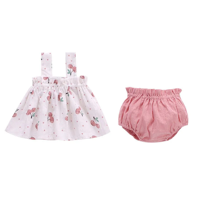 Pink baby girl mini dress with square collar, laid flat, showcasing the full summer outfit design