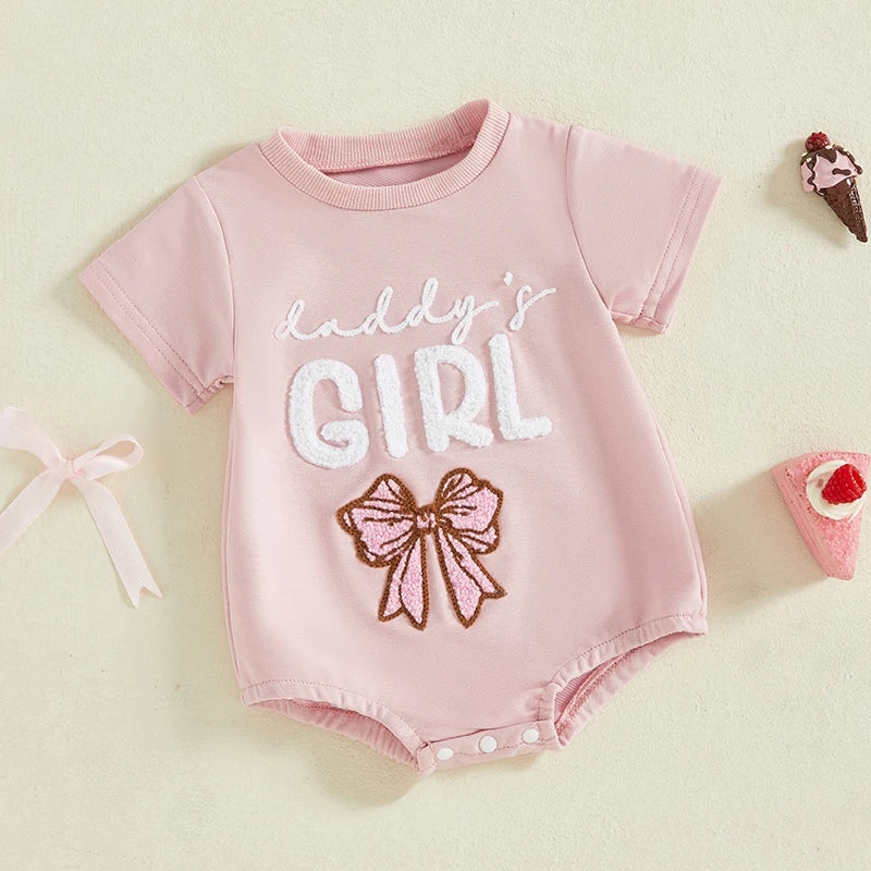 Close-up of 'Daddy's Girl' embroidery on pink cotton blend baby girl romper, summer infant clothes