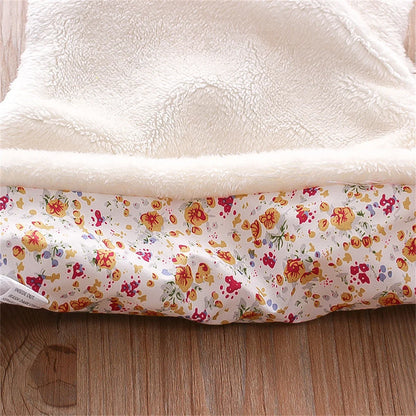 Fashionable pink faux fur vest for toddlers, adorned with delicate flower embroidery.