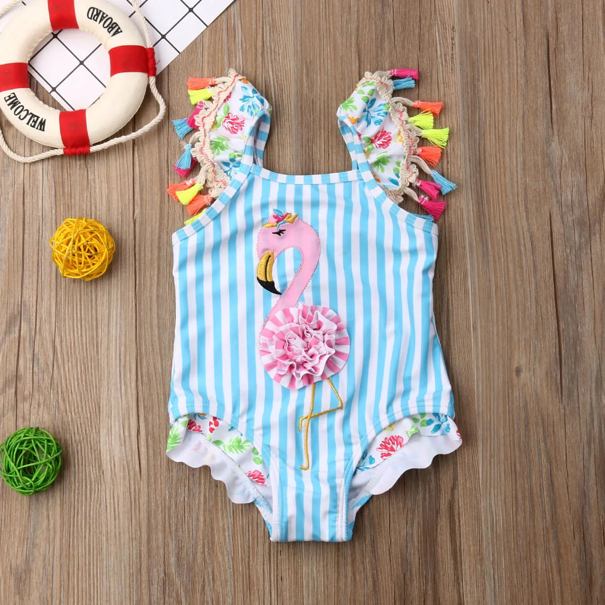 Adorable toddler girls' two-piece flamingo swimsuit with ruffled trim, made from soft cotton.