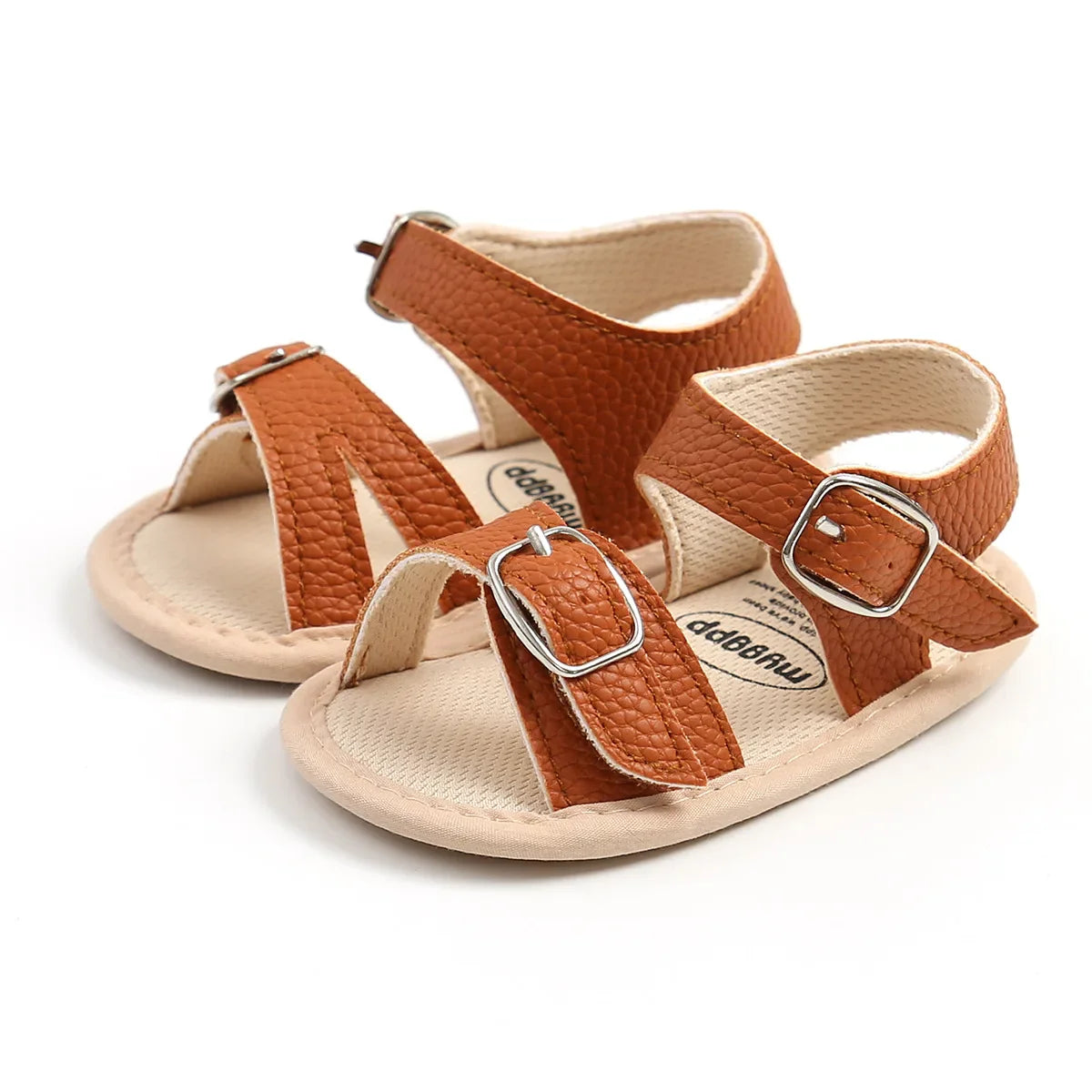 Detailed shot of a baby sandal strap with flower accent, PU leather