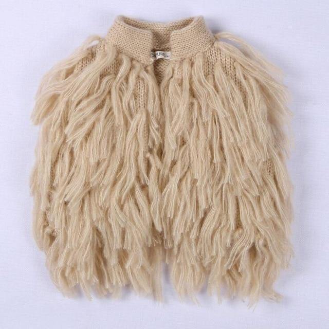Baby girl's woolen sleeveless vest with elegant tassels, ideal for layering, baby outerwear.