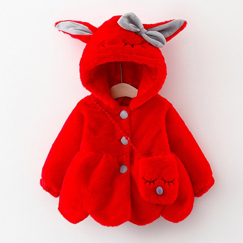 Toddler girl wearing a fuzzy gray plush hooded jacket with sweet rabbit ears, perfect for cold weather.