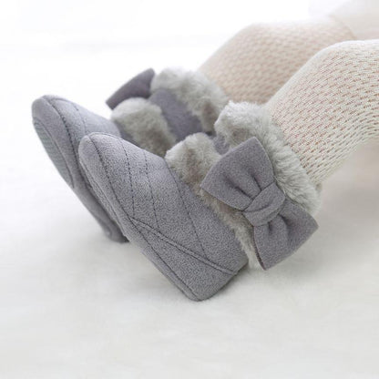Cozy baby girl's bow winter boots, light pink, with secure velcro closure, perfect for cold weather