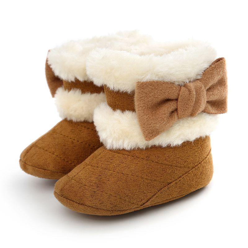 Stylish toddler girl's winter boots featuring a charming bow and soft faux fur lining for comfort