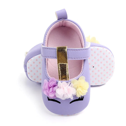 Baby girl's soft sole flower shoes, essential for pre-walking and newborn fashion.