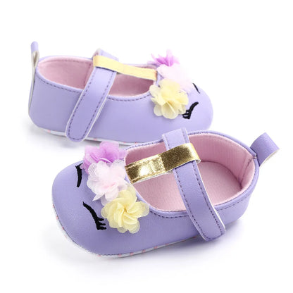 Charming pink baby shoes with flower, pre-walking design for little girls.