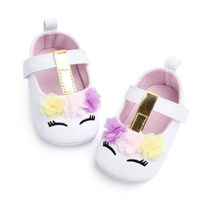 Baby girl's first steps flower shoes, soft sole for gentle support and fashion.
