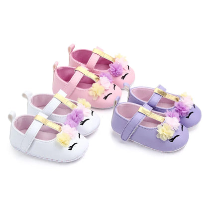 Infant girl's pre-walking shoes with pretty flower detail, soft and supportive.