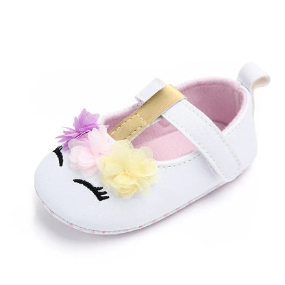 Pretty baby girl pre-walking shoes, pink with floral detail and soft construction.