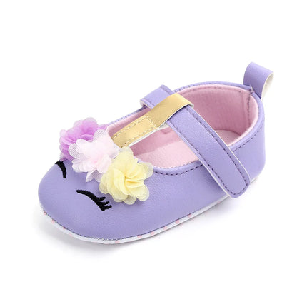 Girl's infant footwear, soft sole flower shoes for support during early walking.