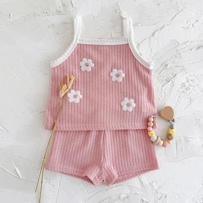 Infant girl's casual summer outfit: ribbed camisole with floral design and matching cotton blend shorts.