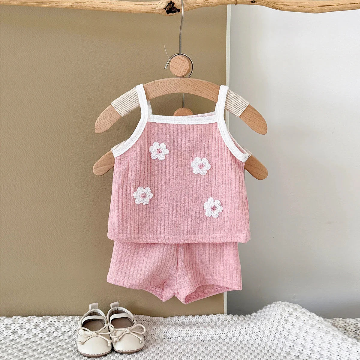 Infant girl's ribbed camisole and matching shorts with charming floral patterns for warm weather.