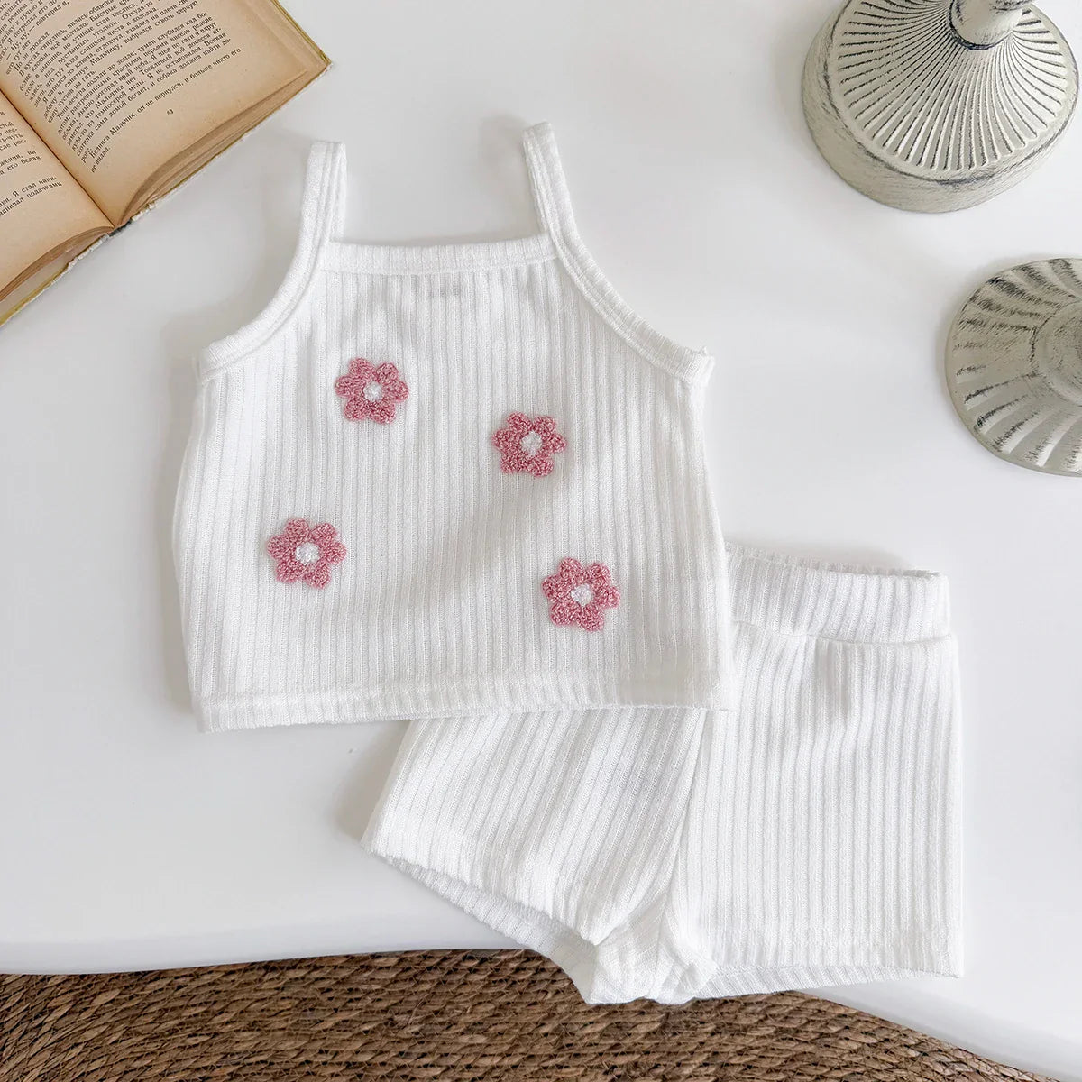 Adorable baby girl's cotton blend ribbed camisole and shorts set with sweet floral accents.