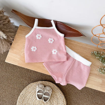 Baby girl's ribbed floral camisole and shorts set, a comfortable and stylish infant clothing option.