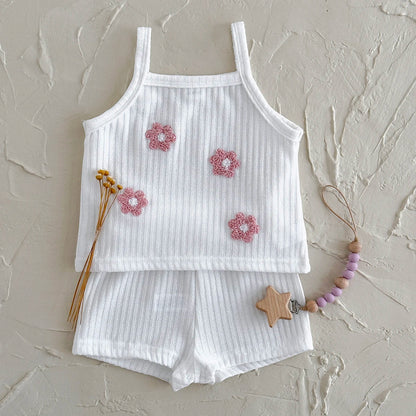 Summer-ready baby girl's two-piece set: floral-embroidered ribbed camisole and coordinating shorts.