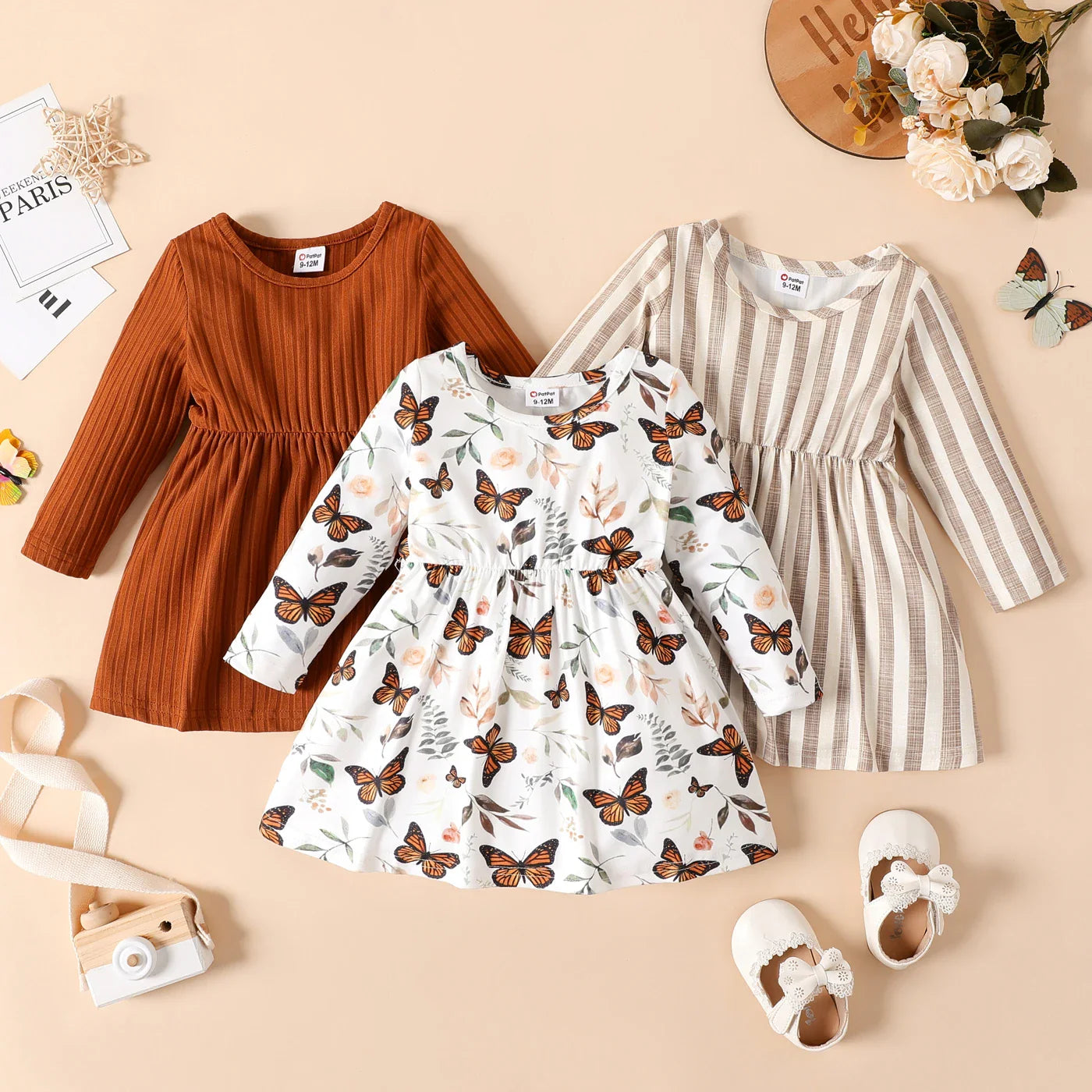 Newborn girl's long sleeve striped party dress, made from comfortable ribbed material, playful design