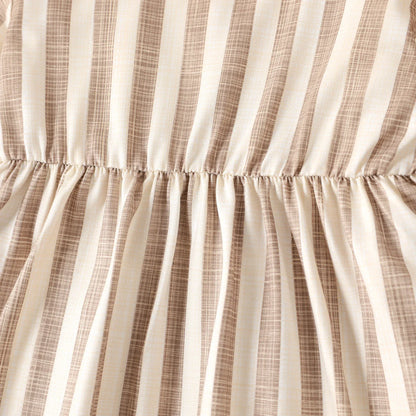 Baby girl's striped ribbed party dress with long sleeves, made for comfort and celebration