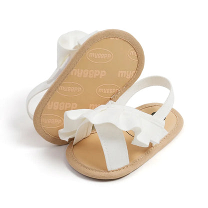Pair of baby girl's light pink ruffled sandals with soft sole and hook-and-loop fastening