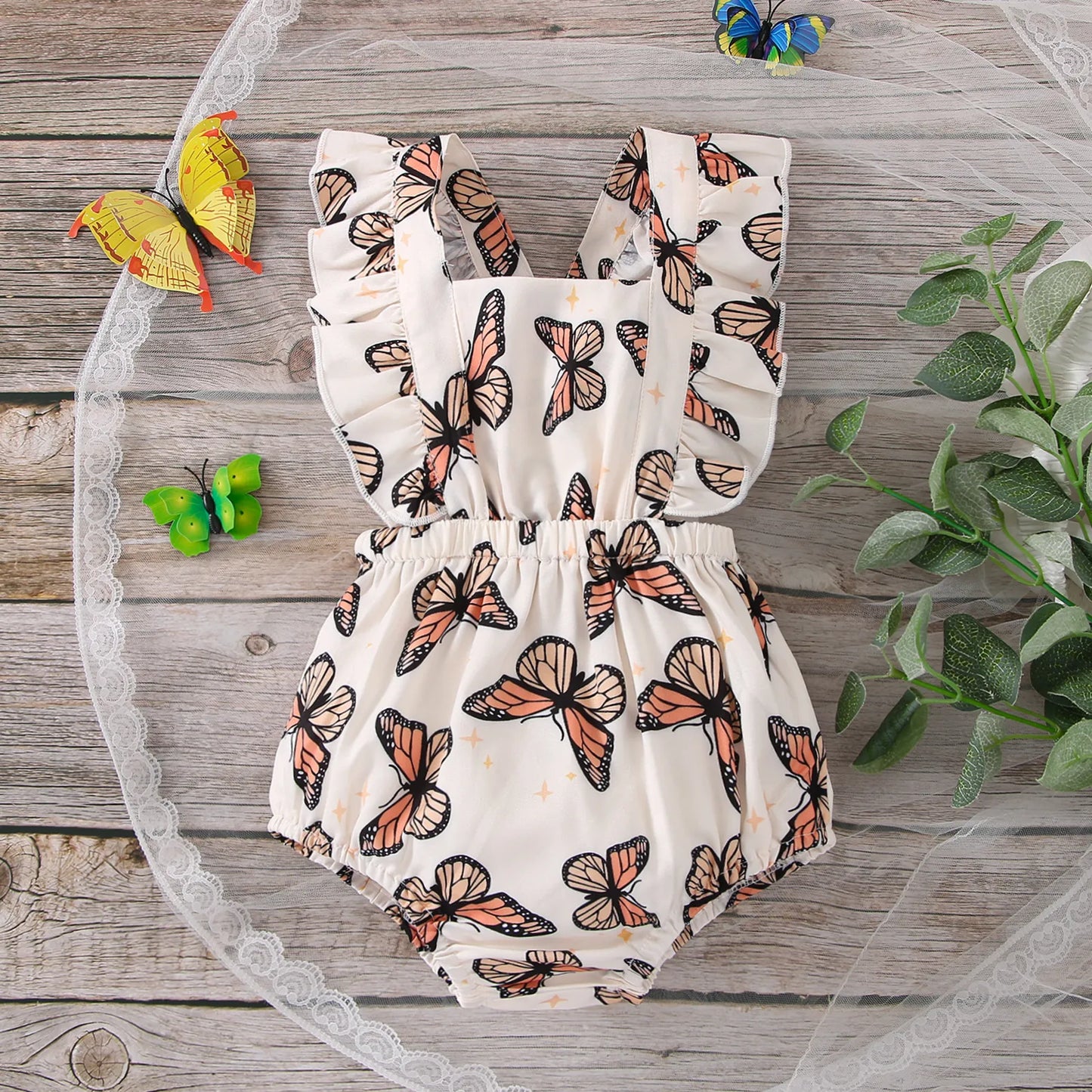 Baby girl's sleeveless bodysuit with pink butterfly print and ruffles, perfect for summer