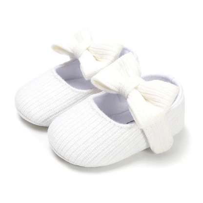 Pink cotton baby girl prewalker shoes with snap-on ribbon, soft sole for infant comfort.