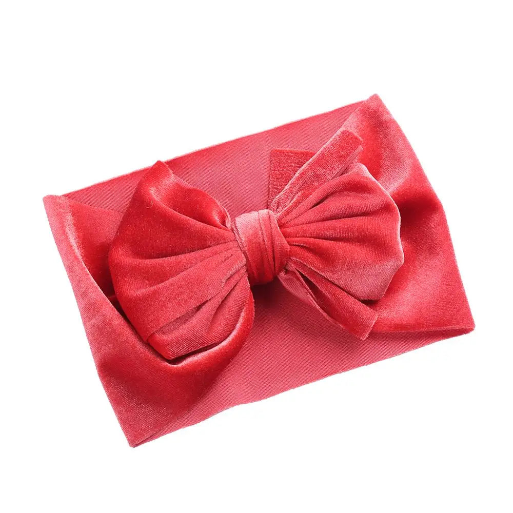 Soft and elastic velvet bow winter headband for baby girls, perfect for chilly days