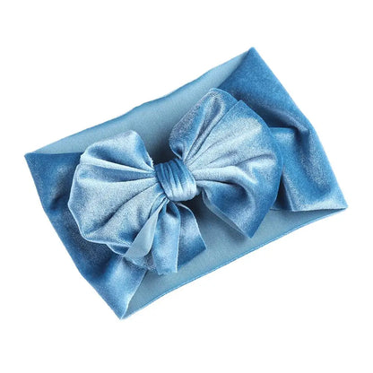 Baby gift idea: a sweet velvet bow winter headband in a gentle blush pink