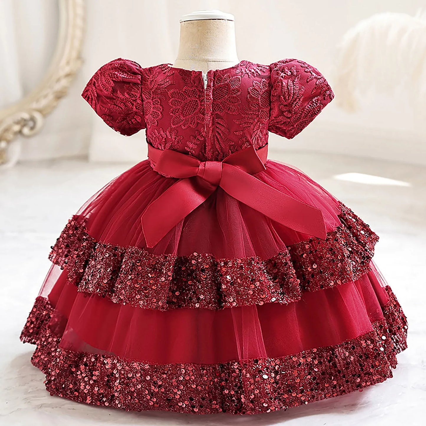 Close-up of glittery sequin bodice on a baby girl's festive tutu party dress