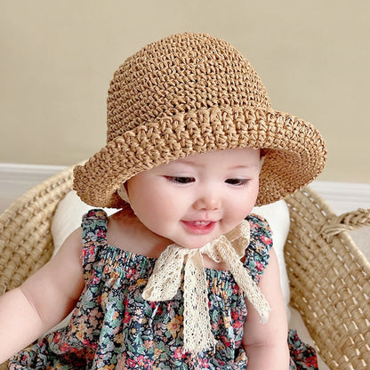 Stylish baby girl's summer hat, crafted from straw with a beautiful lace trim, perfect for sun cover.