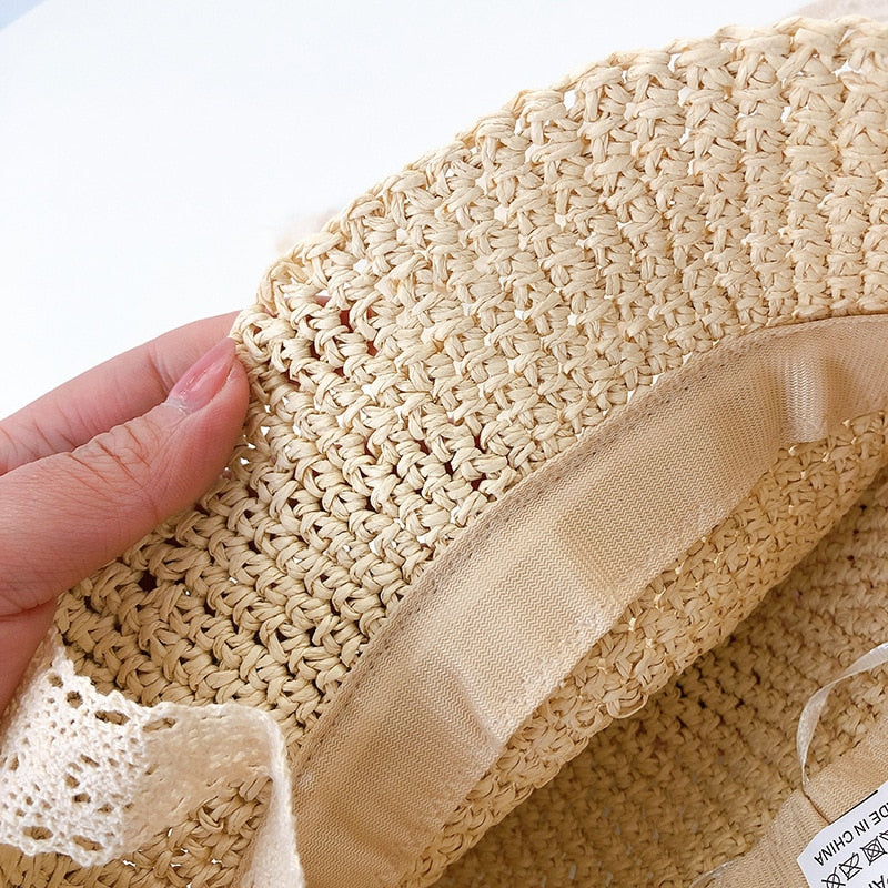 Adorable infant straw sun hat for girls, featuring a delicate lace trim, great for any summer outfit.