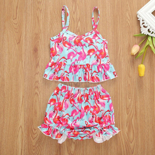 Baby girl's vibrant floral sling top & ruffled shorts summer outfit. Comfortable cotton two-piece set for toddlers.