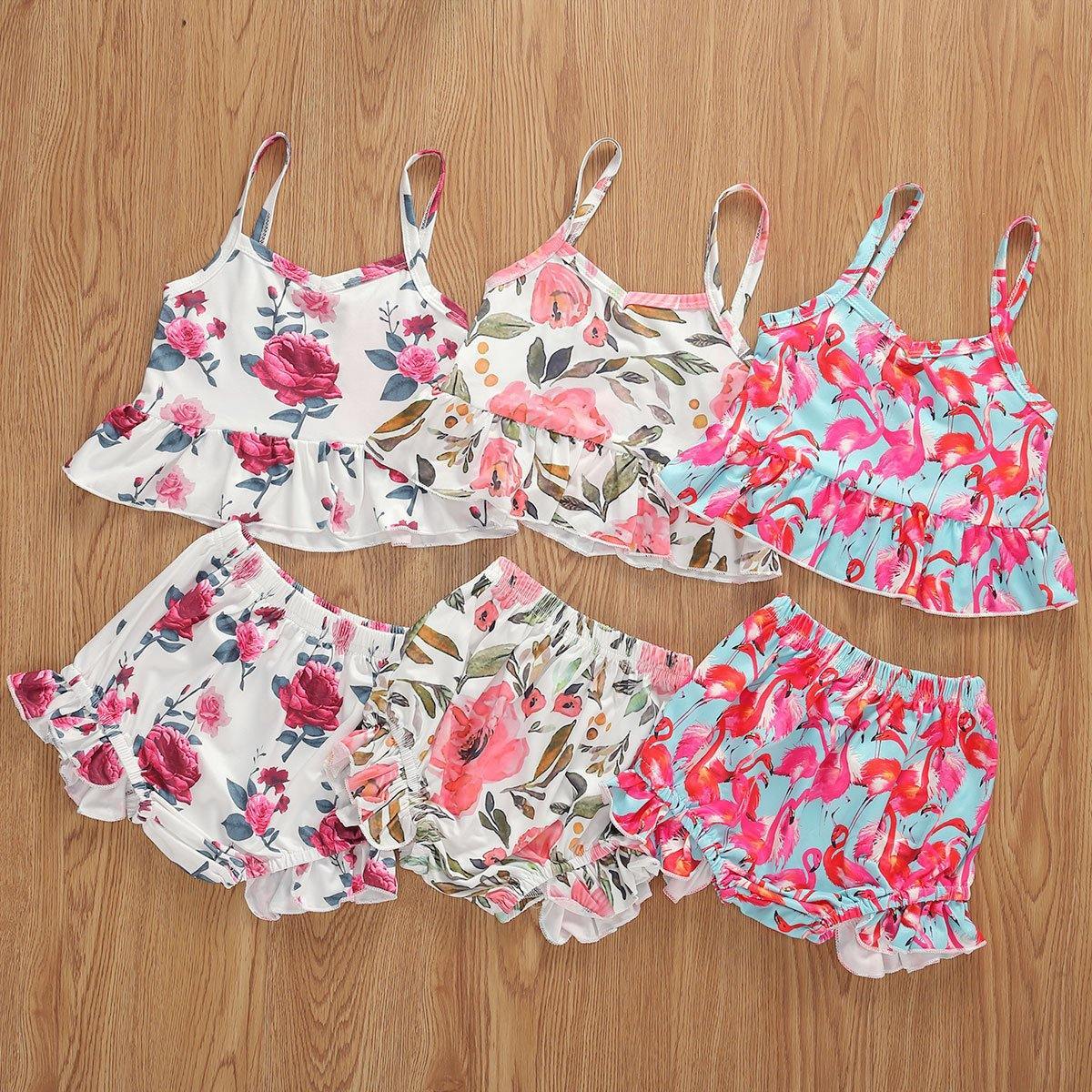 Infant girl's playful floral print sling top & ruffled shorts. Stylish cotton summer fashion for warm weather.