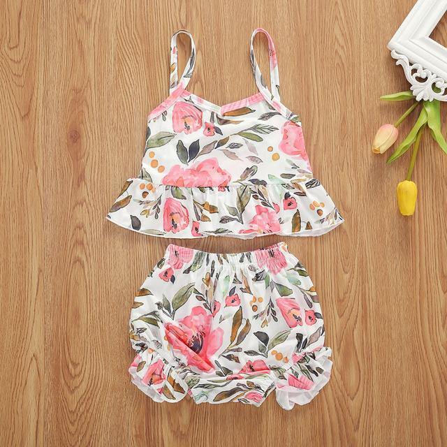Vibrant floral cotton two-piece set for baby girls. Sling top & ruffled shorts perfect for summer playtime.