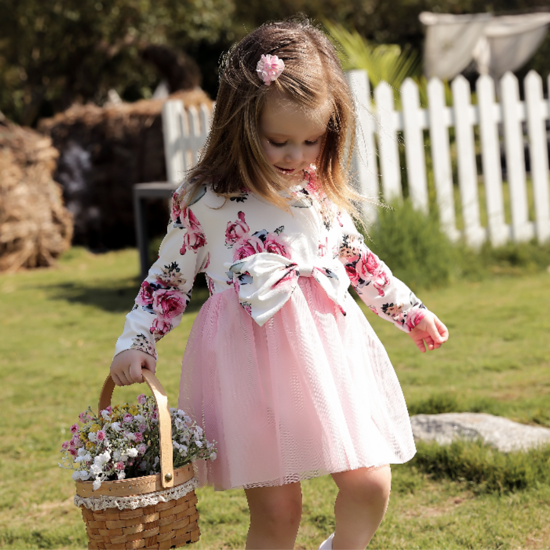 Baby girl's vintage rose print long sleeve dress with bow design at waist for infants.