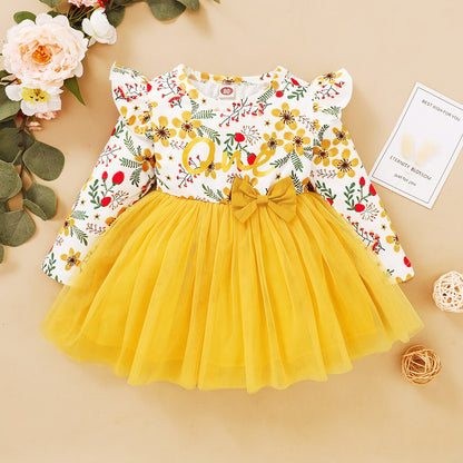 Flowy baby girl's dress with vintage rose pattern and a cute bow, ideal for girly fashion.