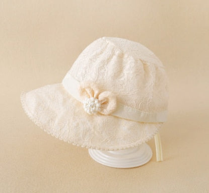 Toddler girl's summer sun hat with elegant lace detail and a protective brim.