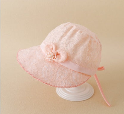 Adorable baby girl's sun hat, crafted with intricate lace and a comfortable fit.