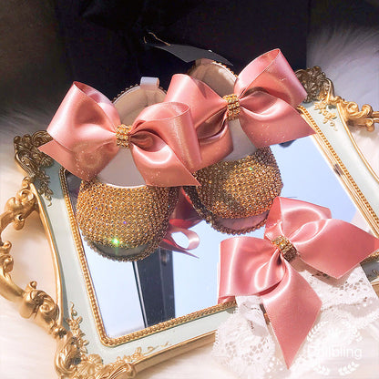 Two-piece set: baby girl's pearl ribbon first walker shoes and coordinating baby pacifier.