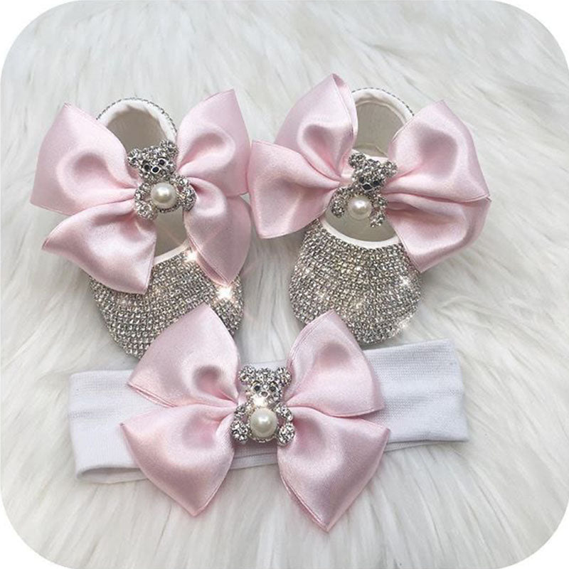 Soft cotton baby girl first walker shoes featuring pearl embellishments and satin ribbons.