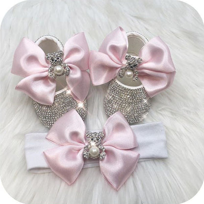 Soft cotton baby girl first walker shoes featuring pearl embellishments and satin ribbons.