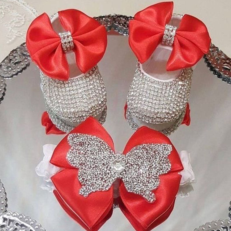 Baby girl's baptism footwear: white first walker shoes with pearl and ribbon design, includes pacifier.