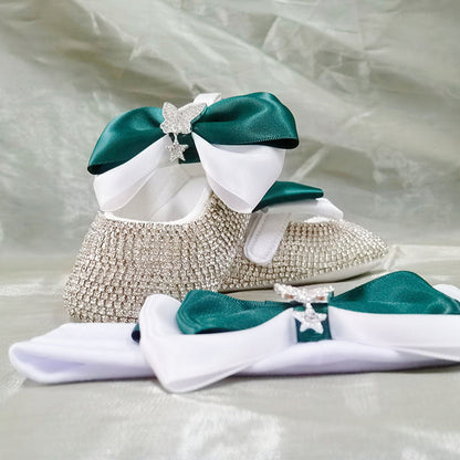 Adorable baby girl's special occasion shoes – white pearl ribbon first walkers plus a pacifier.