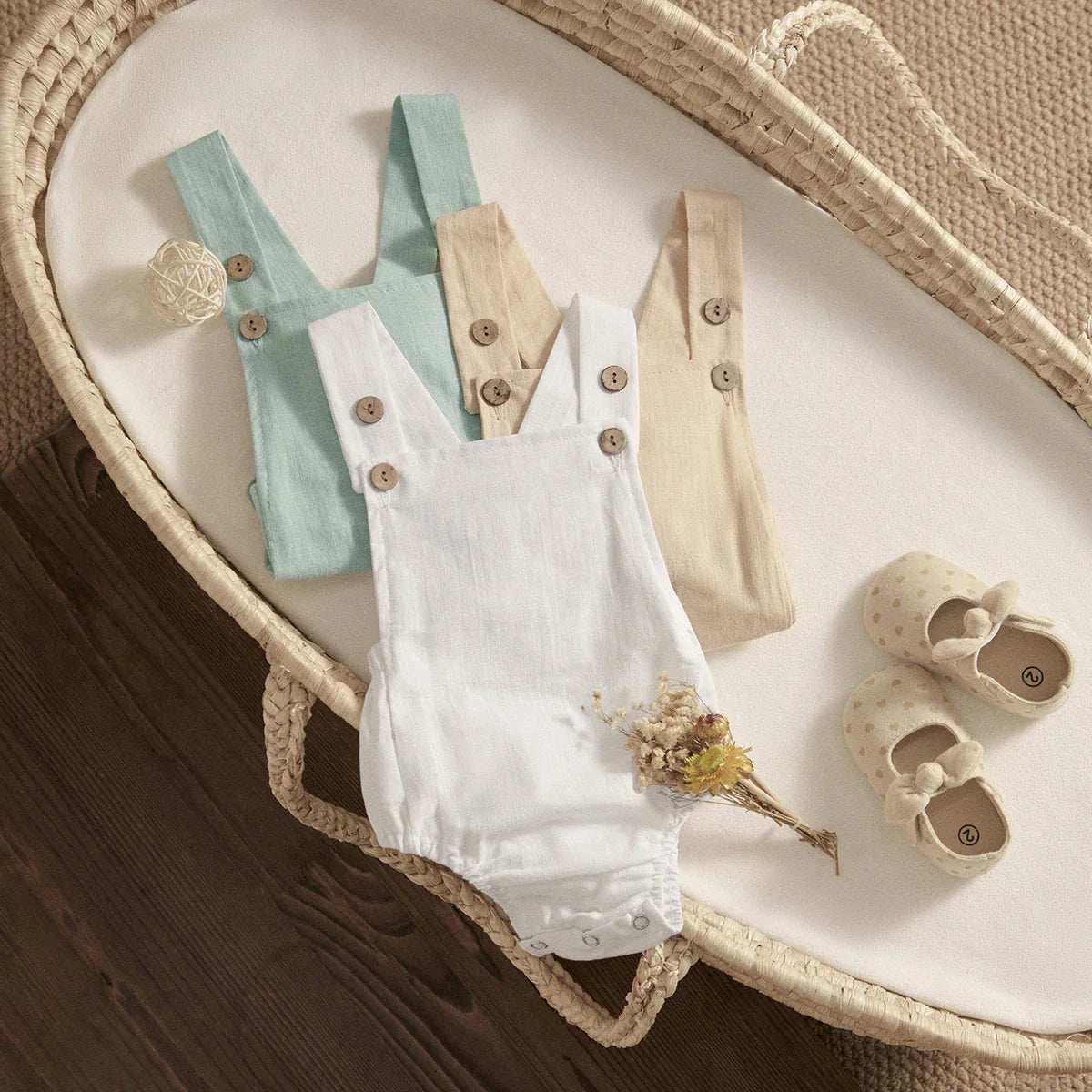 Infant girl's pink sleeveless cotton romper with cute bow detail, summer fashion