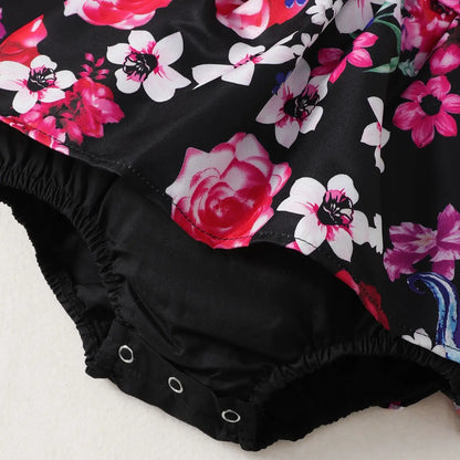 Full view of a baby girl in a cute sleeveless floral print dress, ideal for summer outfits