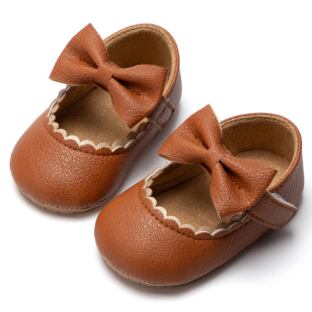 Toddler girl pink soft sole shoes with cute bowknot detail, ideal first walker footwear