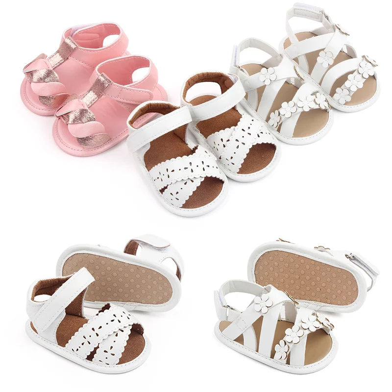 Closeup of soft PU sole baby sandals in pink, perfect summer footwear for toddler girls.