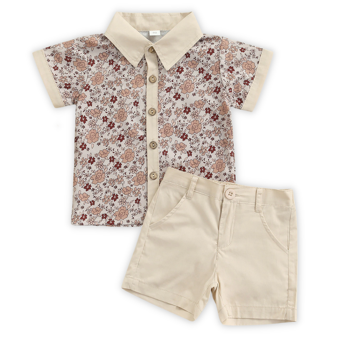 Close-up of matching floral print fabric on baby romper and toddler dress for siblings, summer